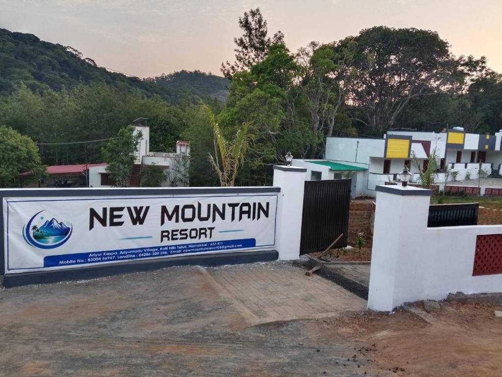 a sign for a new mountain resort at New Mountain Resort in Nāmakkal
