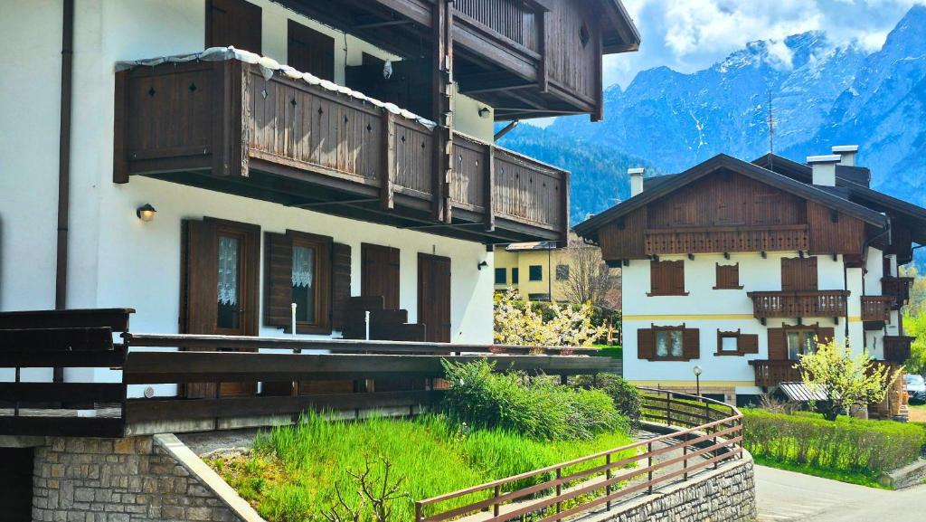 a building with wooden balconies on top of it at Saroio B in Auronzo di Cadore