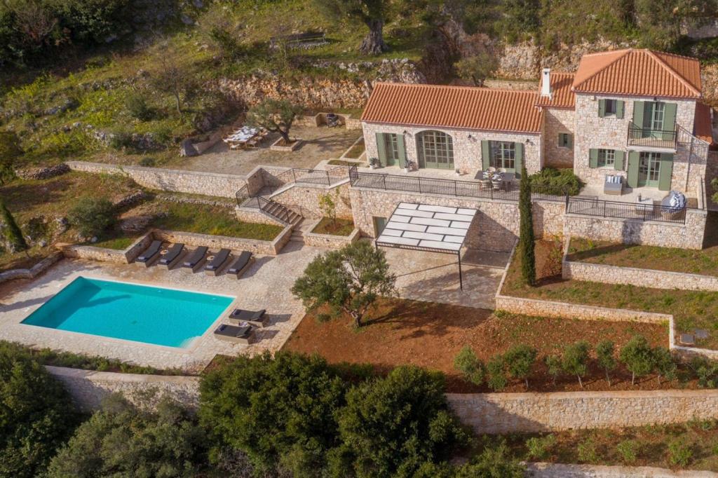 an overhead view of a house with a swimming pool at Villa Athena in Agios Nikolaos