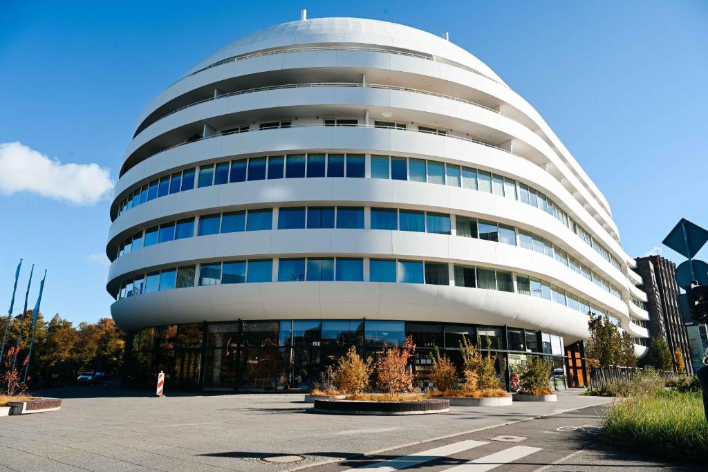 a large white building with a lot of windows at Lumina OVO2 in Wrocław