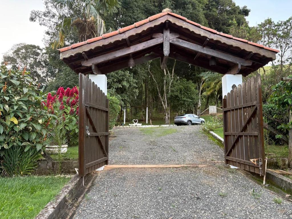 a gate in a garden with at Chacara el Angel in Socorro