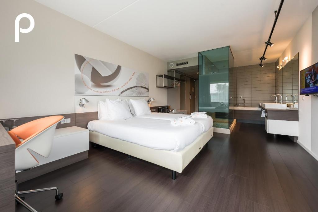 Postel nebo postele na pokoji v ubytování Hotel Papendal
