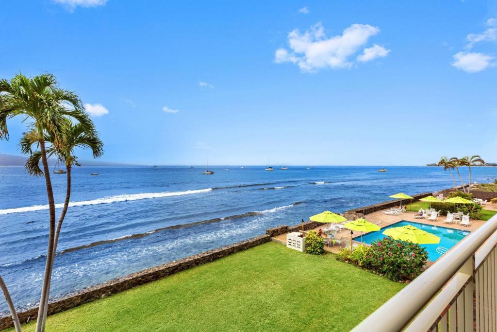 a view of the ocean from the balcony of a resort at Lahaina Roads 302 in Lahaina