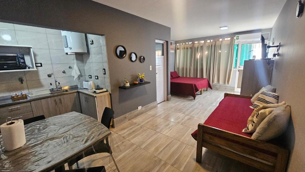 a room with a kitchen and a living room at El Racimo, dpto en Ciudad de Mendoza in Mendoza