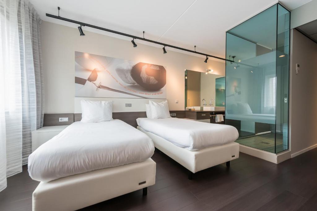 Postel nebo postele na pokoji v ubytování Hotel Papendal
