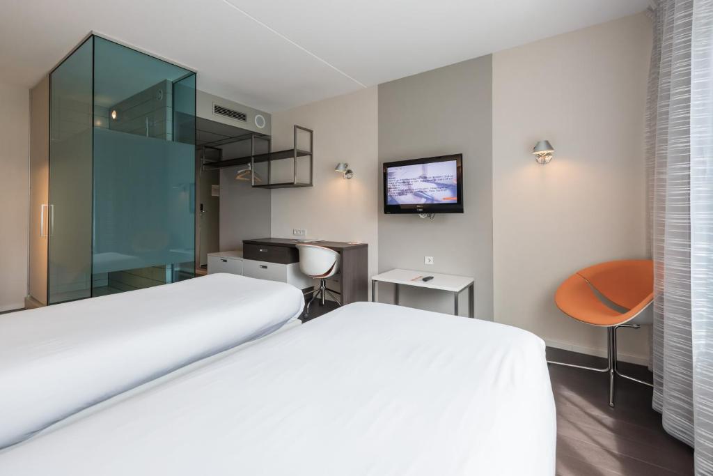 Postel nebo postele na pokoji v ubytování Hotel Papendal