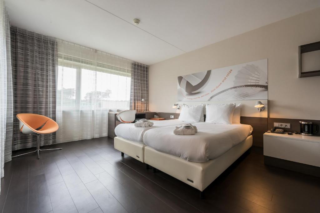 Postel nebo postele na pokoji v ubytování Hotel Papendal
