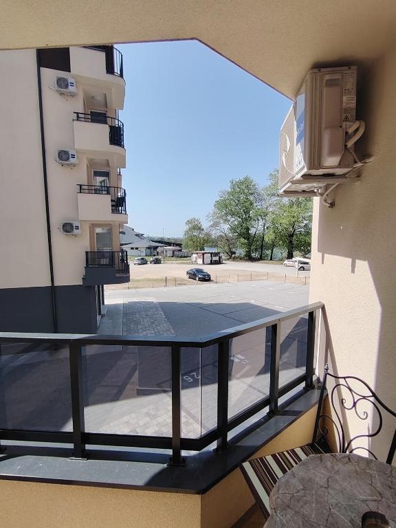 a balcony with a view of a parking lot at Silver Moon 1 in Veliko Gradište