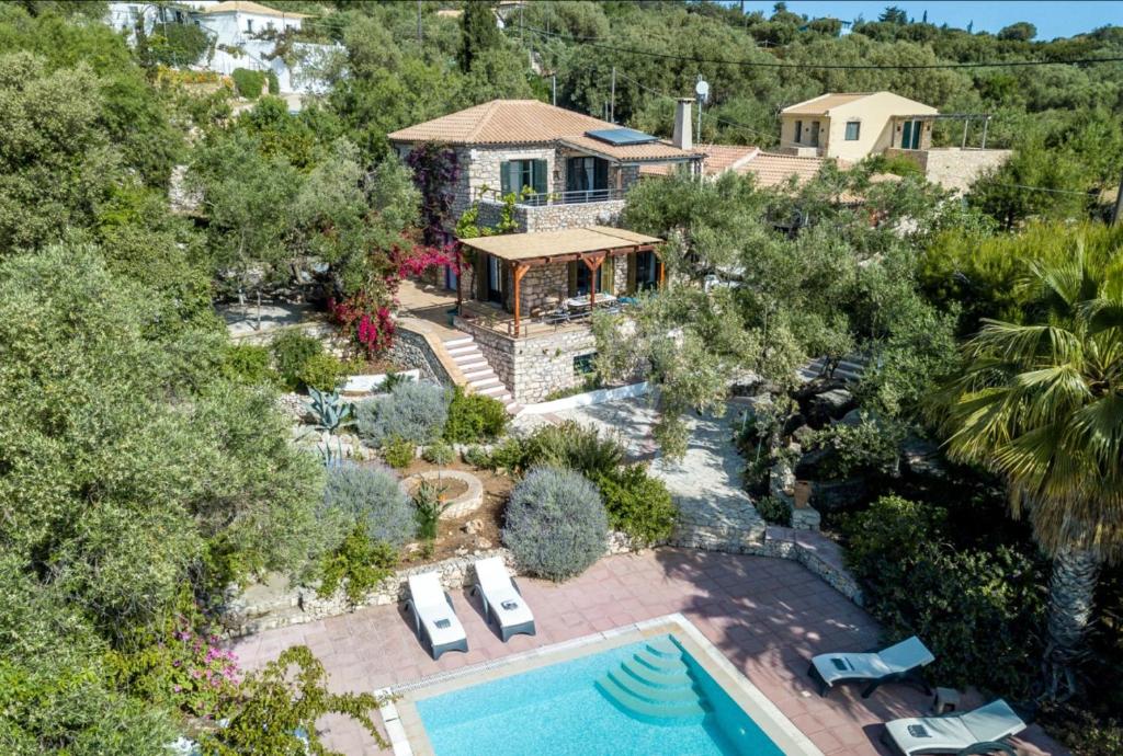 an aerial view of a house with a swimming pool at Villa Aeolus Stylish Villa with Pool Masterbedroom with seperate Mezzanine in Koríthion