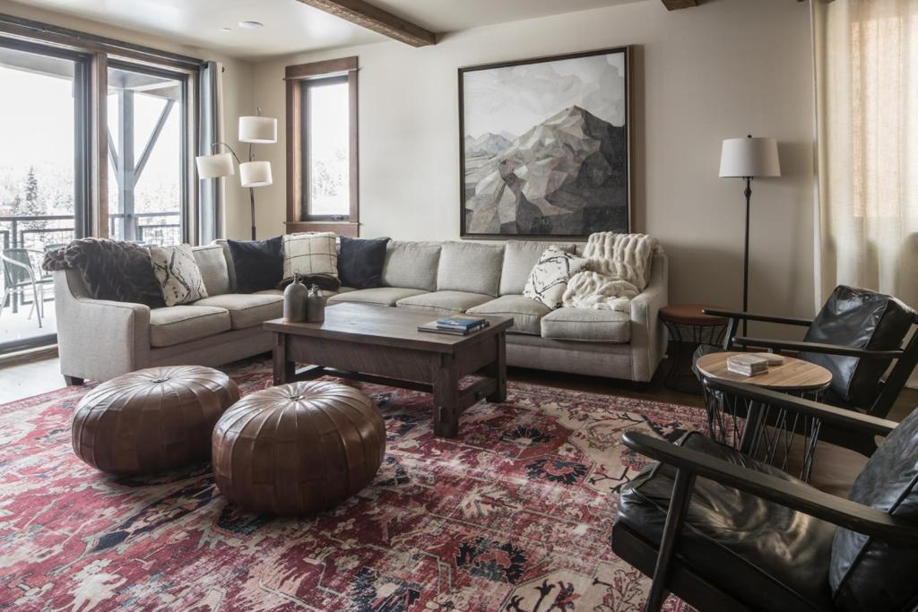 a living room with a couch and a table at Mountain Lake Condo - Unit 401B in Big Sky