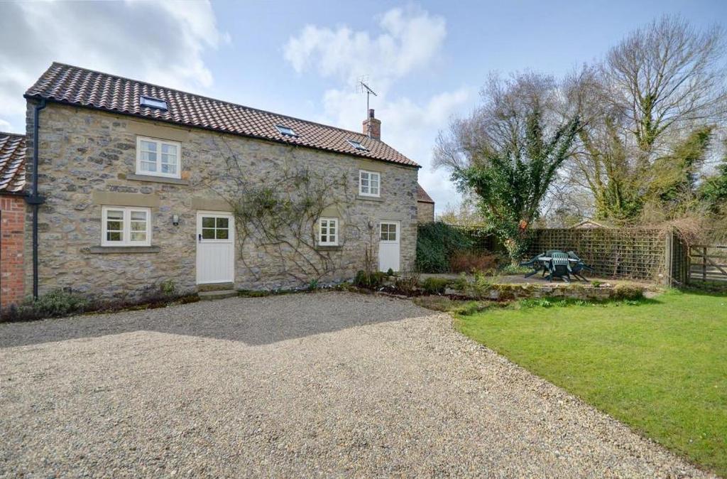 an old stone house with a gravel driveway at 2 Bed in Pickering oc-y012 in Pickering