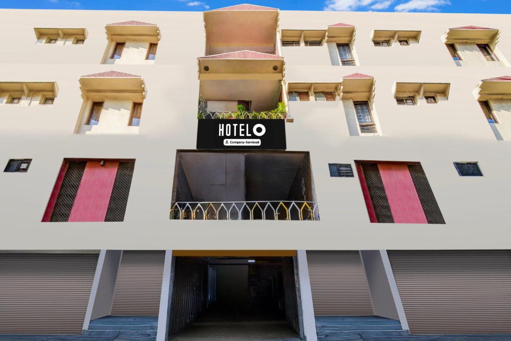 a building with a hotel sign on it at Hotel O Paradise Circle in Hyderabad