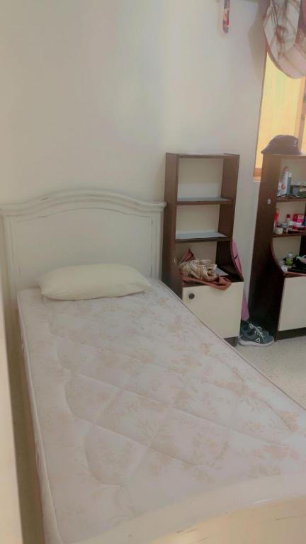 a bedroom with a white bed in a room at MALTA TOURs in St. Paul's Bay