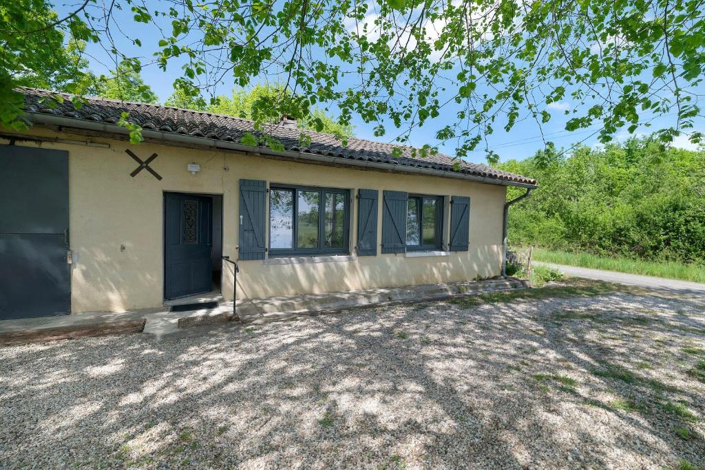 a house with a large driveway in front of it at Gite Les 3 Tilleuls in La Ville Dieu du  Temple