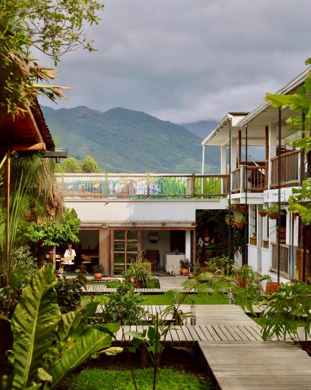 a view of a house with mountains in the background at Terasu Hotel Boutique Salento in Salento