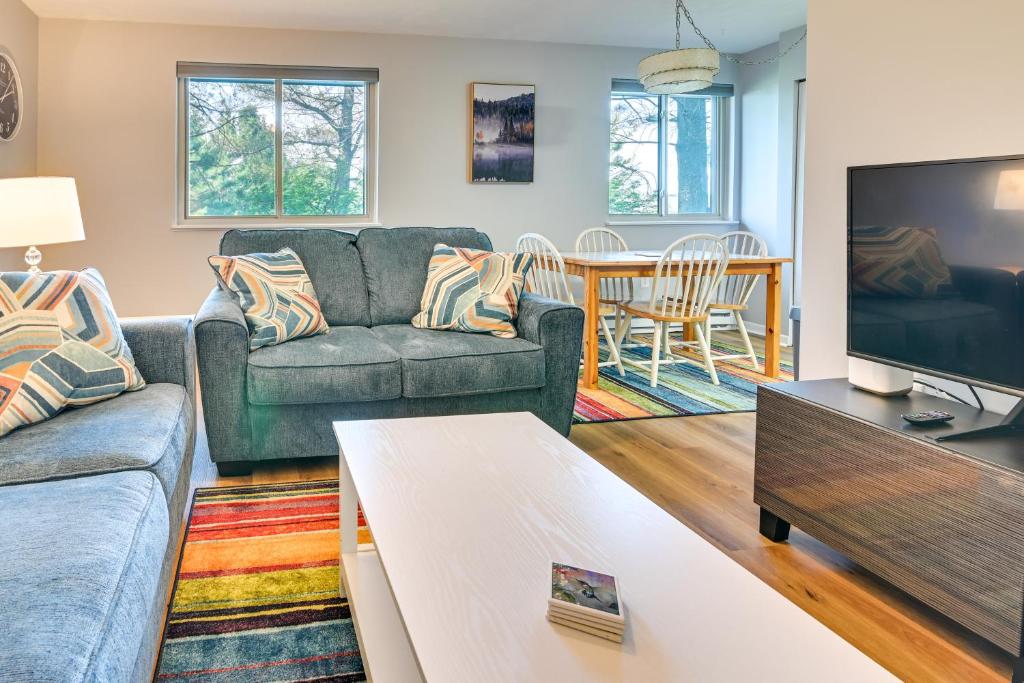a living room with a couch and a tv at Mountain Maryland Adventures Await in McHenry