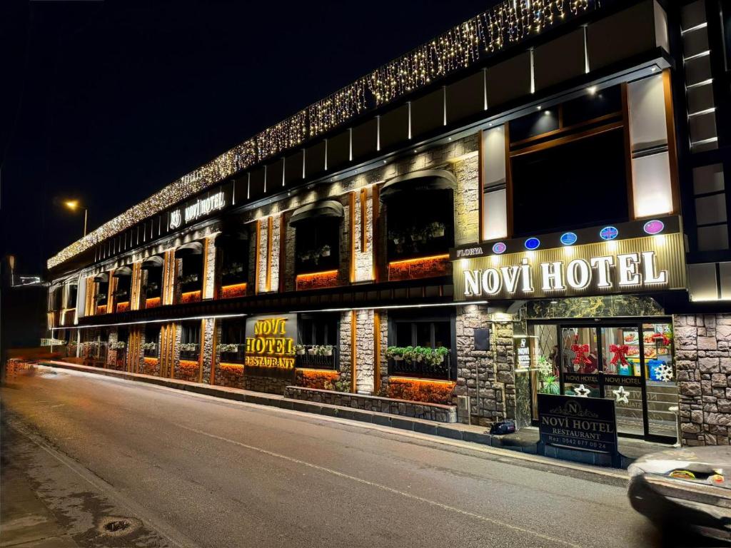 a now hotel is lit up at night at Florya Novi Hotel in Istanbul