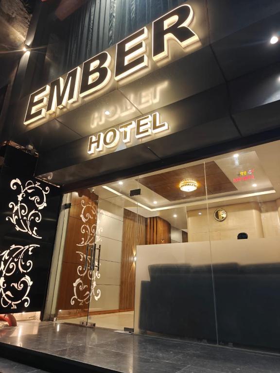 a hotel sign on the front of a building at Hotel Ember in Alwar