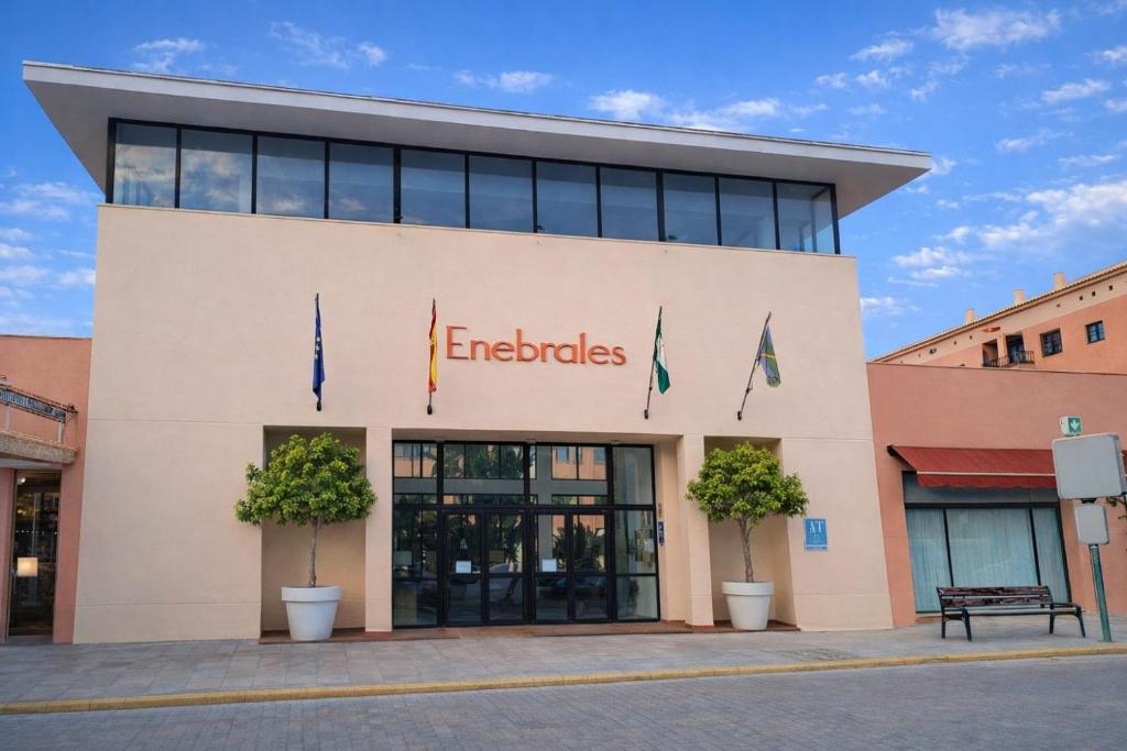a building with the word endocles on it at Enebrales 423 in Punta Umbría
