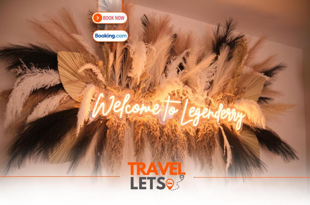 a sign that says welcome for departure with feathers at 2 Bedroom House By Travel Lets Holiday Homes Derry With Garden in Derry Londonderry