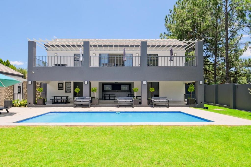 a house with a swimming pool in the yard at The Gentle Abode in Sandton