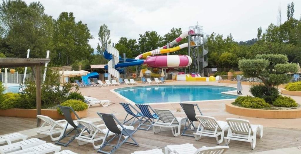 a pool at a resort with a water slide at Mobil-home val de durance in Cadenet