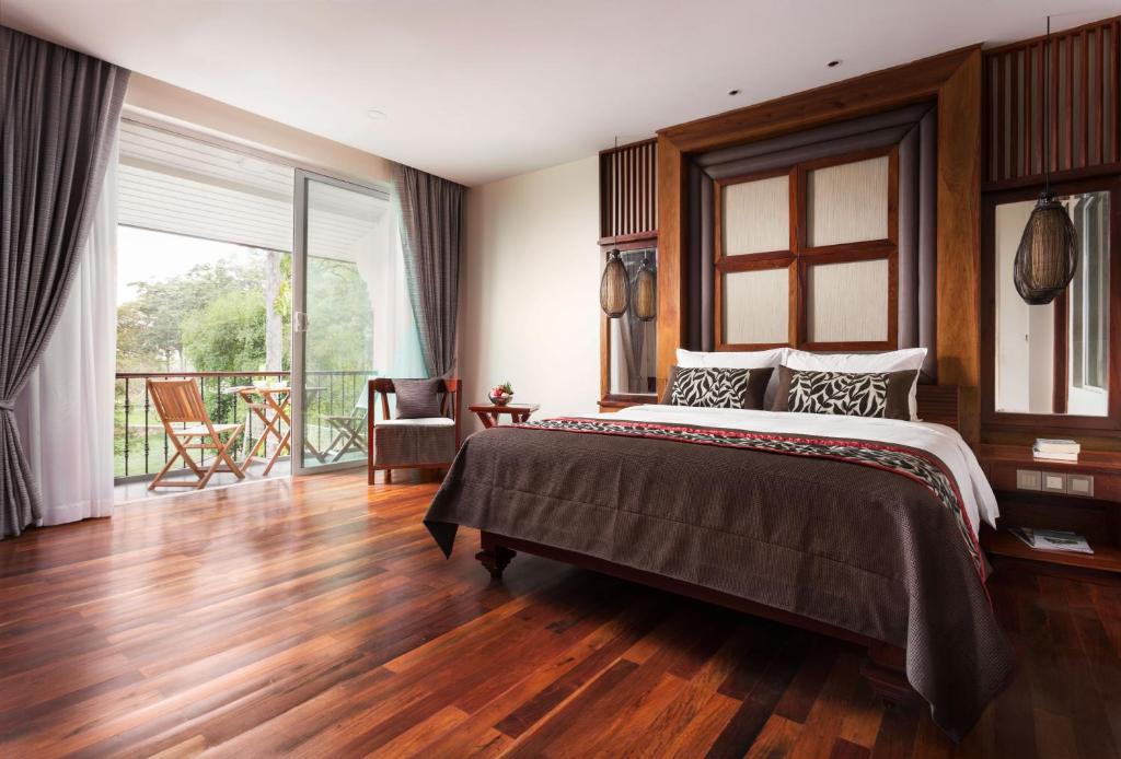 Postel nebo postele na pokoji v ubytování J7 Angkor Hotel