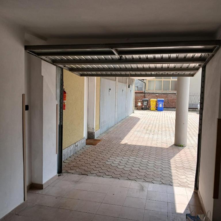 an empty hallway of a building with ailed floor at Il bosso in Ciriè