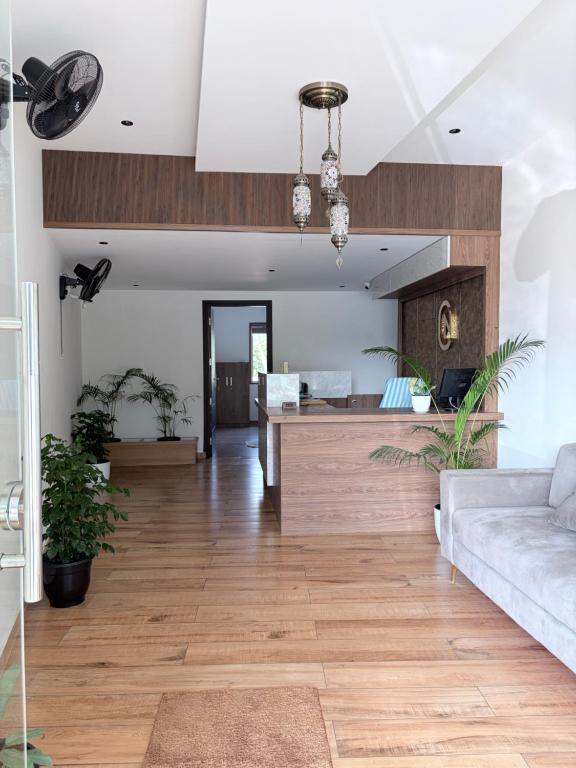 a living room with a couch and a table at Cozy Nook Inn - A BB Linens Experience in Vythiri