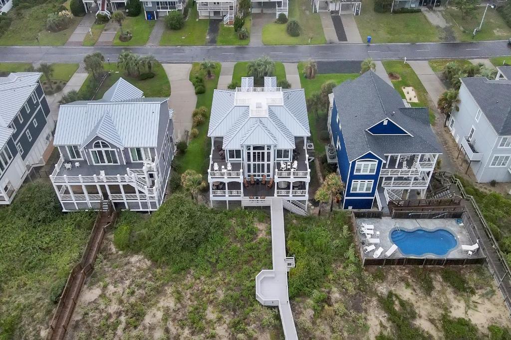 an aerial view of a house with a pool at Surviving Stress by Oak Island Accommodations in Caswell Beach
