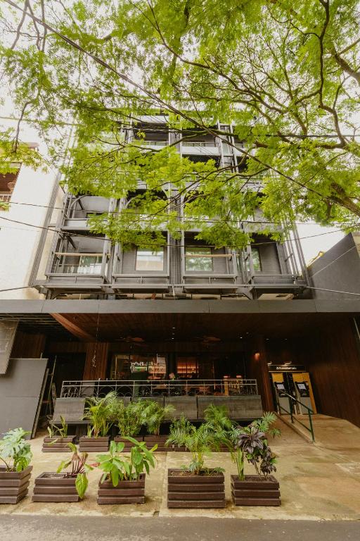 a building with plants in front of it at Hotel Belisario in Medellín