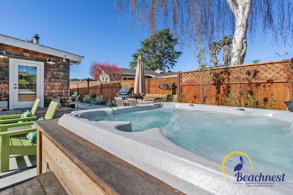 a hot tub in the backyard of a house at Tiki Tides in Rio Del Mar