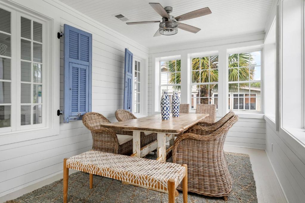 a dining room with a table and chairs at Beach Bungalow Upper Unit Steps To Shore in Isle of Palms