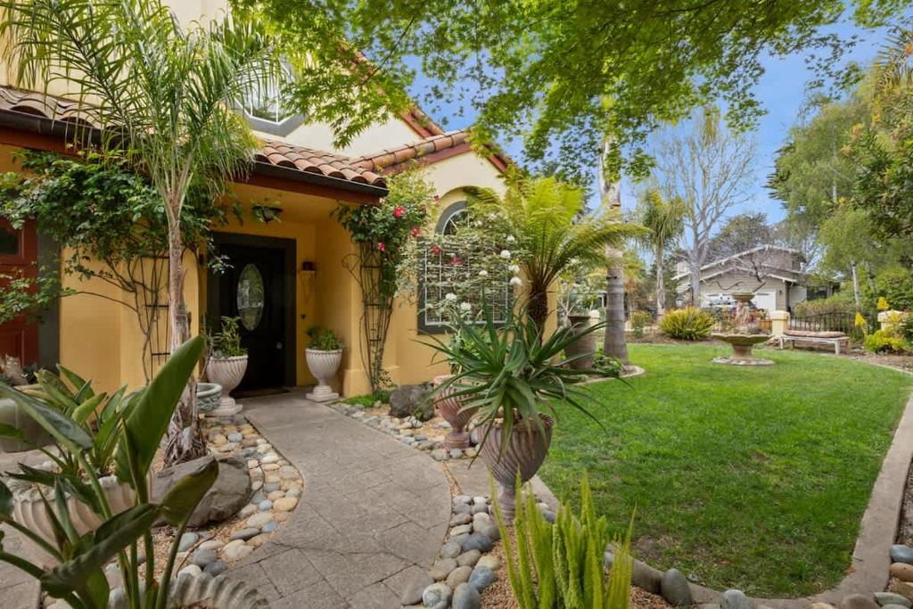 a house with a walkway in front of a yard at Acanto Del Mar in Aptos