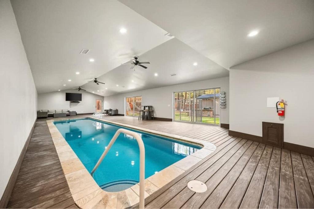 a large swimming pool in a house at Rare Indoor Pool, Game Room & Courts, 5 Blocks to Snow Summit in Big Bear Lake