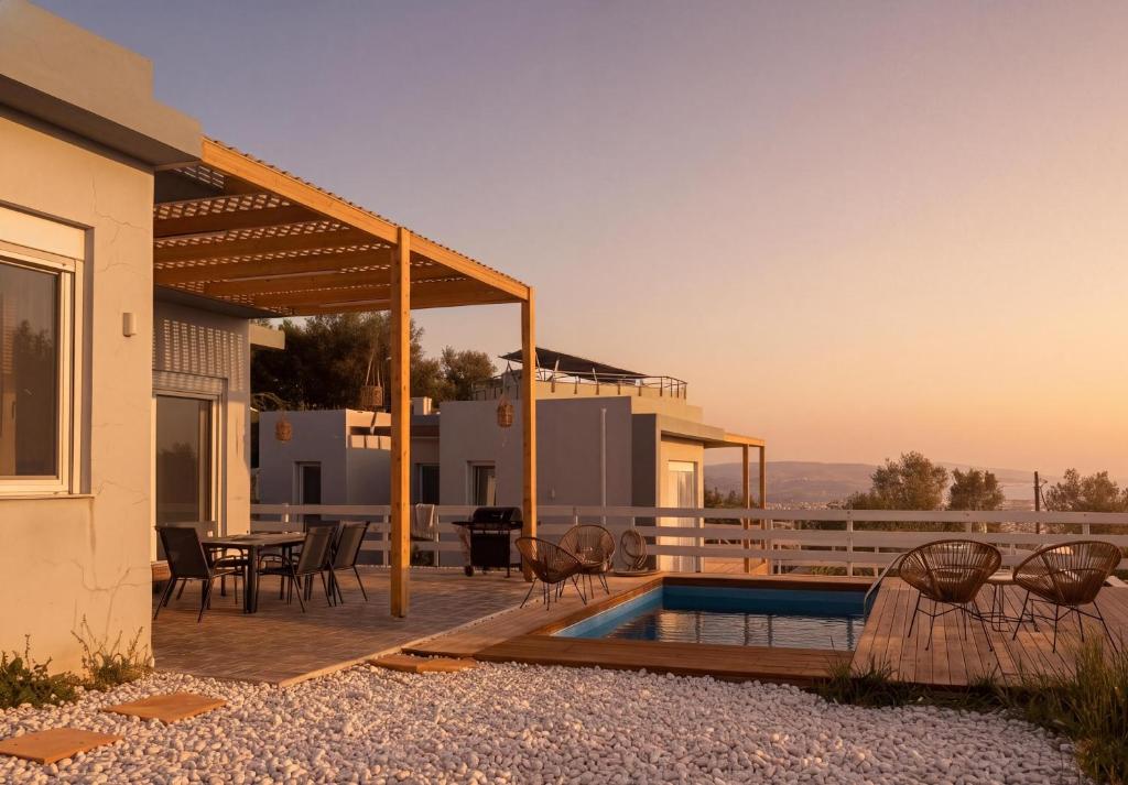 a house with a swimming pool and a patio at Klima Breeze in Klíma