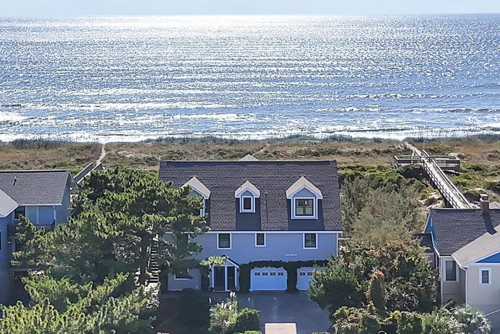 an aerial view of a house next to the ocean at Jonahs Whale by Oak Island Accommodations in Caswell Beach