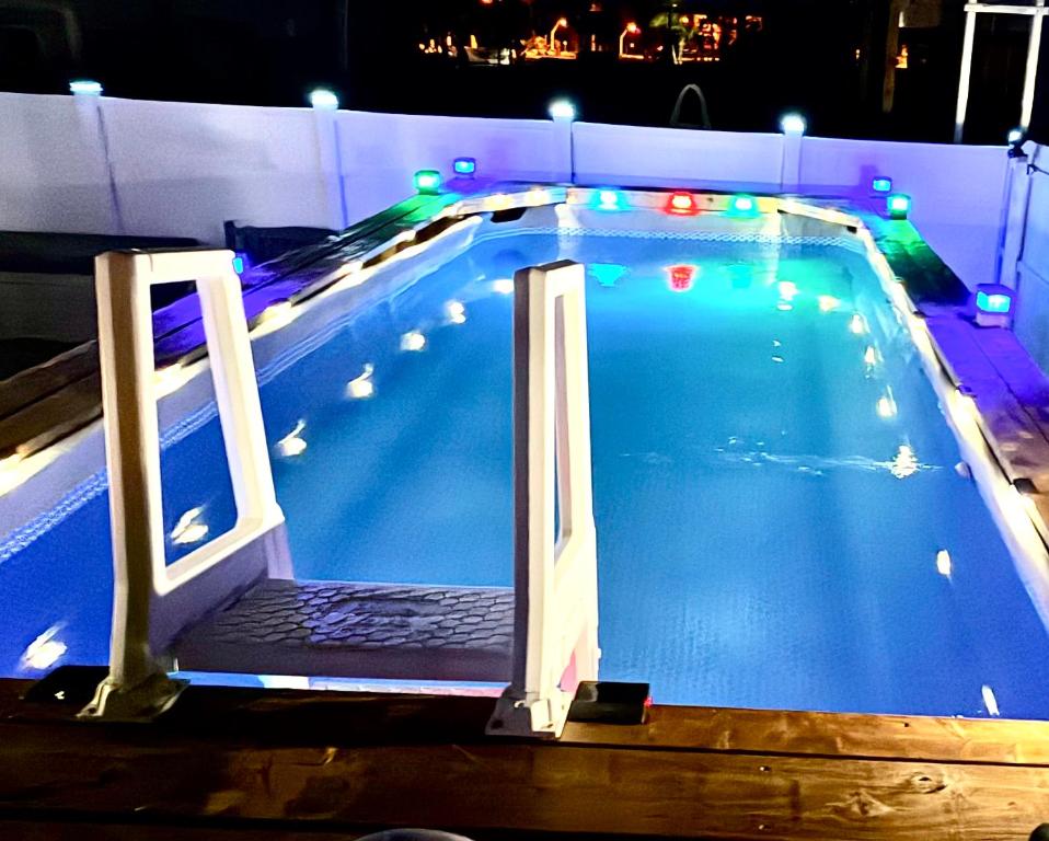 a large swimming pool with lights on top of it at Sunset by the Sea 3054 in Fort Myers Beach
