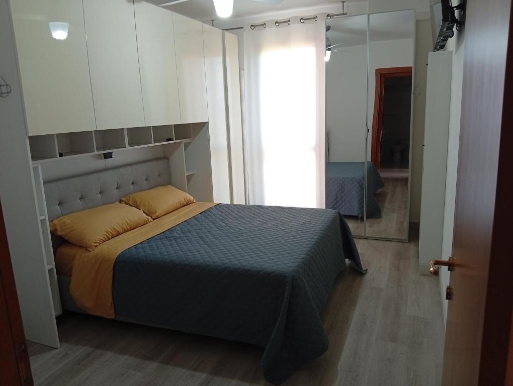 a bedroom with a bed and a large mirror at Casa Rotary in Lugo