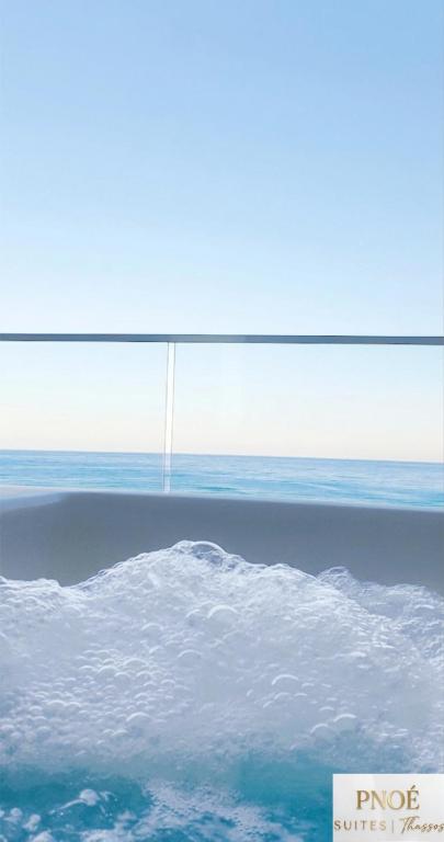 a view of the ocean from an airplane window at Pnoé Sea View Suites in Limenas