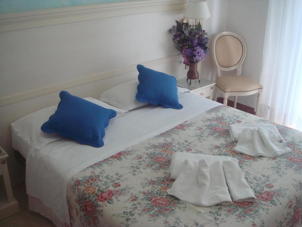 Postel nebo postele na pokoji v ubytování Hotel Arcade