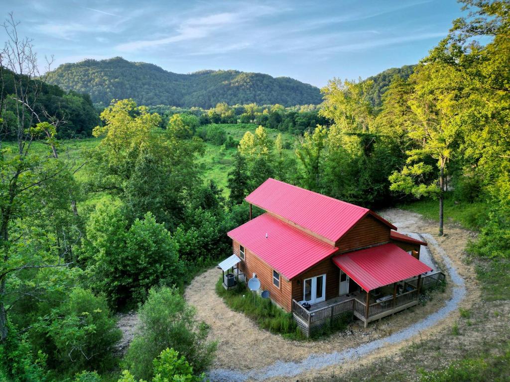 an overhead view of a small cabin with a red roof at Just Right- RRG -Relaxing - Secluded in Slade