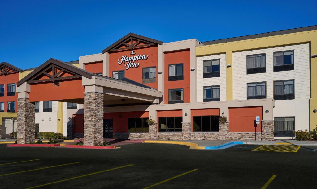 an empty parking lot in front of a hotel at Hampton Inn Anchorage in Anchorage