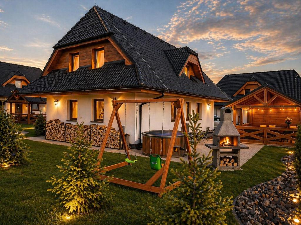 a house with a gazebo in the yard at Vila Svistovka in Stará Lesná