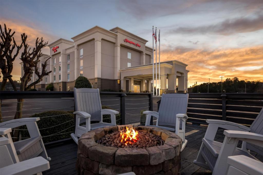 a fire pit on a deck in front of a hotel at Hampton Inn Guntersville in Guntersville