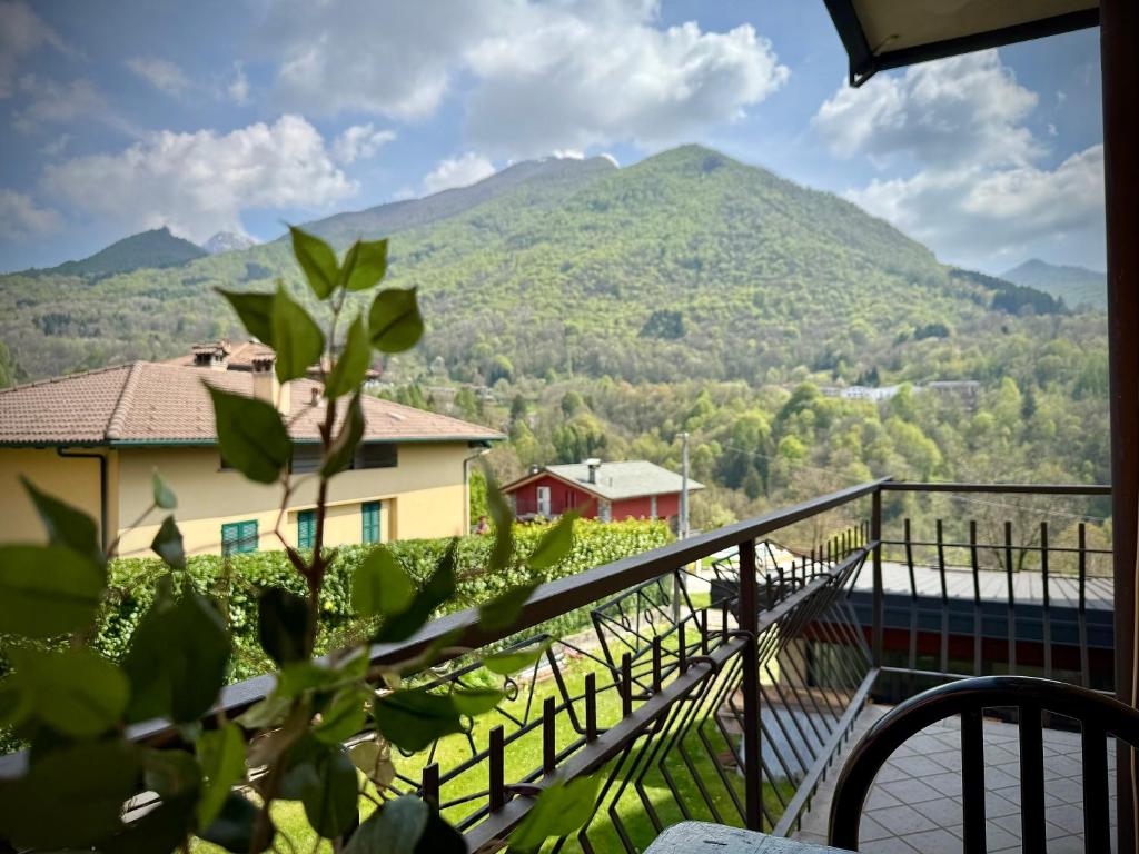 a balcony with a view of a mountain at Casa Aurea Lake Como Apartment in Esino Lario