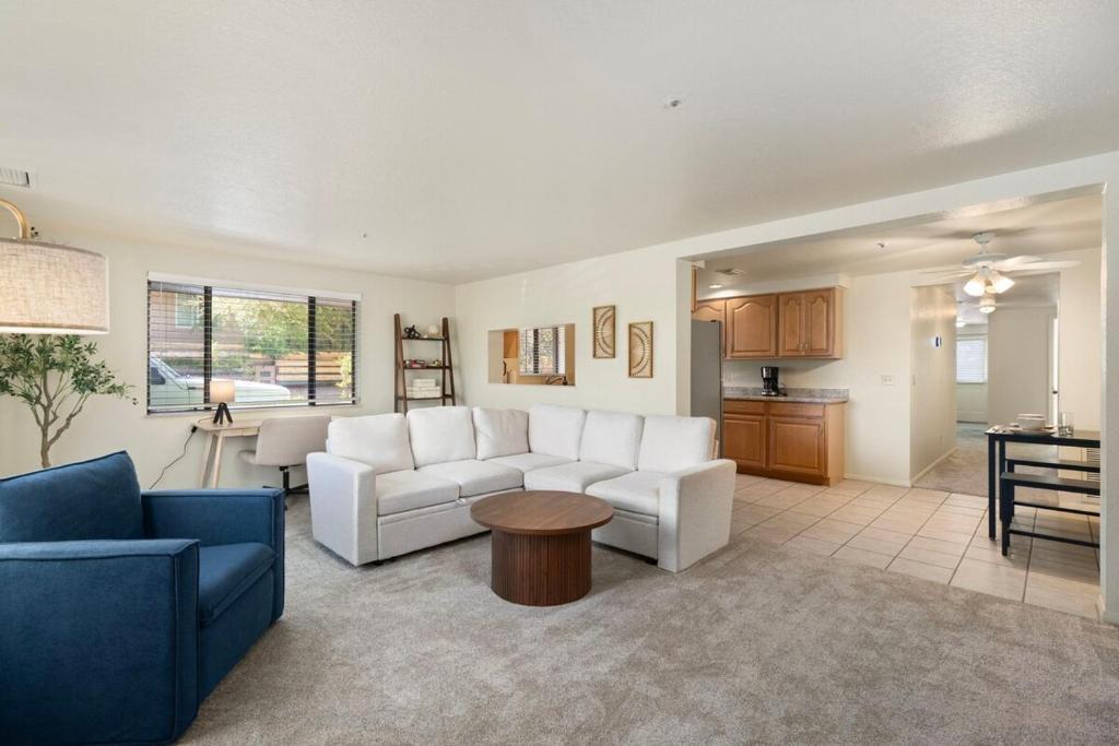 a living room with two couches and a kitchen at Sedona Spacious 2BR Desert Escape in Sedona