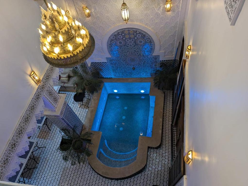 an overhead view of a swimming pool in a building at Riad Diamant Bleu in Fez
