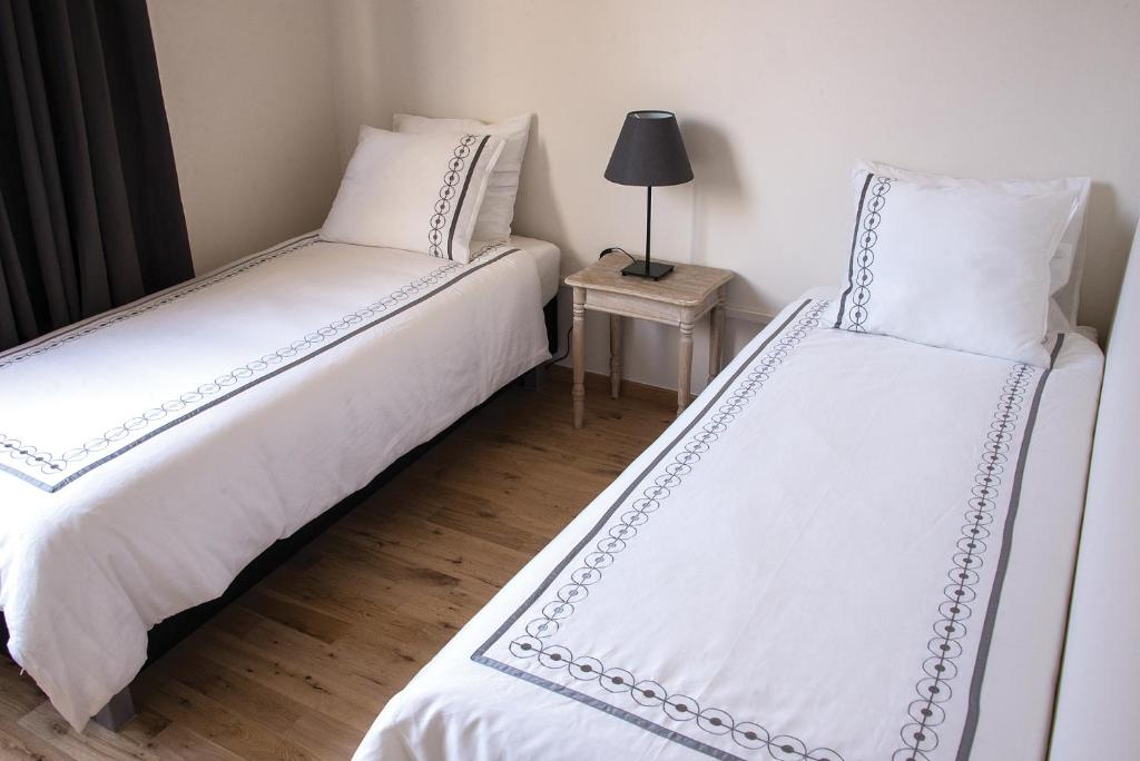 Postel nebo postele na pokoji v ubytování Hotel Saint Georges