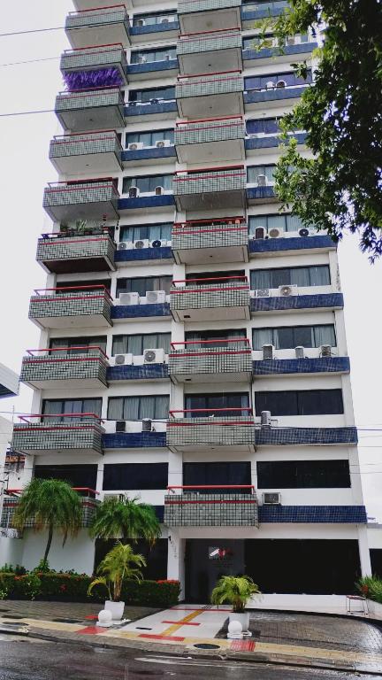 a tall building with balconies on the side of it at Hotel Centro de Manaus próximo ao Teatro Amazonas in Manaus